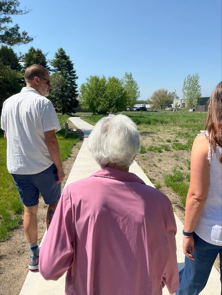 Nonprofit Spotlight: Wilbur and Charlotte Courter Memory Center 5 A group of people walks along a pathway.